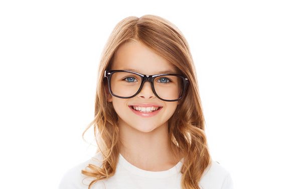 smiling cute little girl with black eyeglasses - Фото, изображение