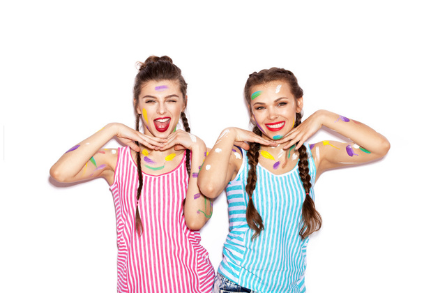 Two young painted girl friends having fun - Foto, imagen