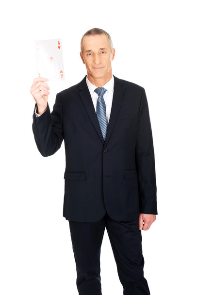 Elegant business man with red ace card - Zdjęcie, obraz