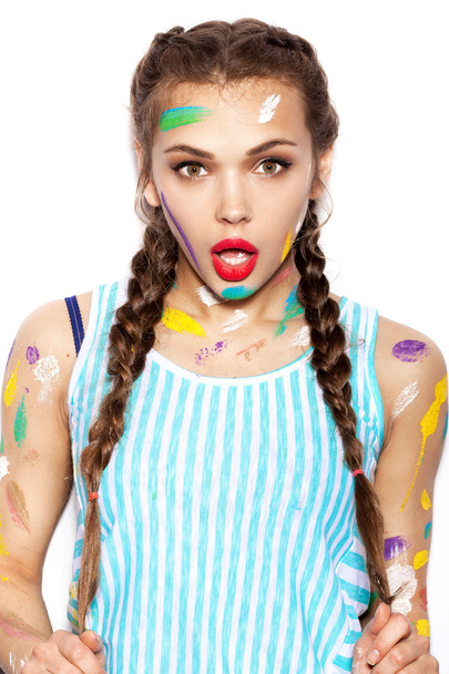 Young cheerful soiled in paint girl having fun - Zdjęcie, obraz