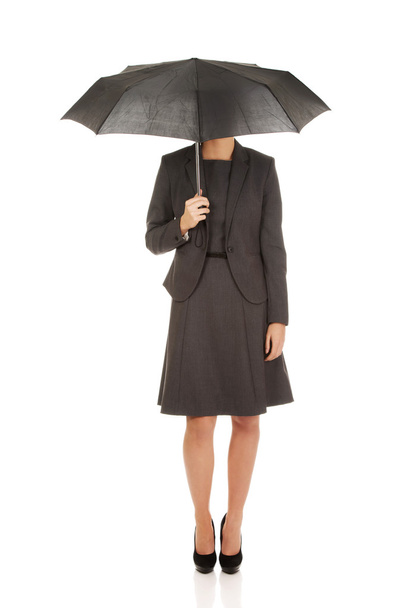 Businesswoman holding an umbrella. - Fotografie, Obrázek