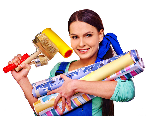Builder woman with wallpapers. - Фото, изображение