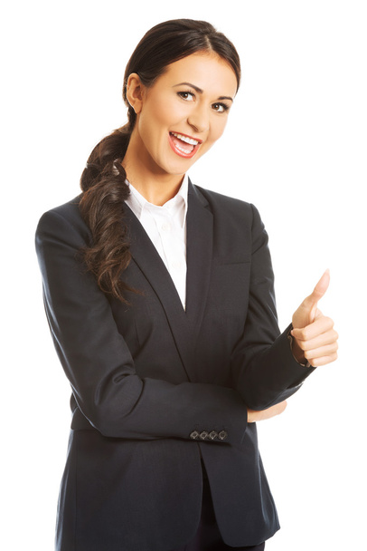 Businesswoman with thumb up gesture - Фото, изображение