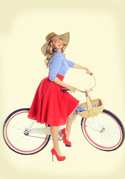 Girl with a bicycle in a retro style - Photo, Image