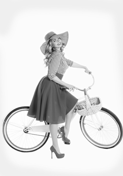 Girl with a bicycle in a retro style - Valokuva, kuva