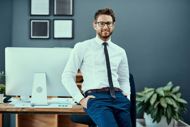 Portrait, office and male accountant with glasses for confidence, smile and proud in workplace. Businessman, success and comfort for leadership, company management and professional in industry. - Photo, Image