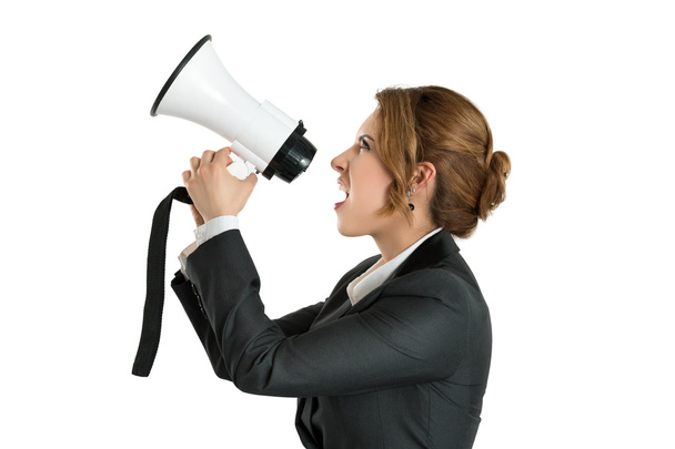 Angry business woman shouting with a megaphone - Fotoğraf, Görsel