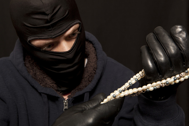 Thief with a pearl necklace - Photo, Image