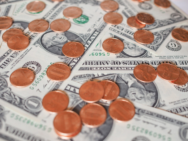 moedas e notas em dólares
 - Foto, Imagem