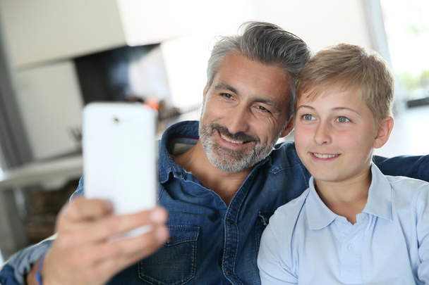 Father and son taking picture of themselves - Zdjęcie, obraz