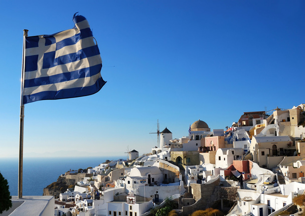 Paesaggio di Oia con bandiera greca
 - Foto, immagini