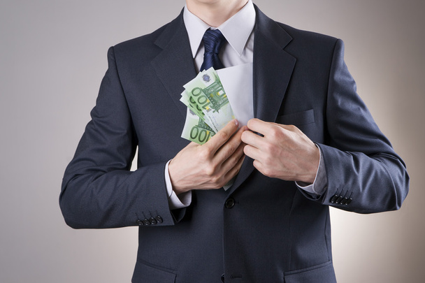 Businessman with money in studio - Fotoğraf, Görsel