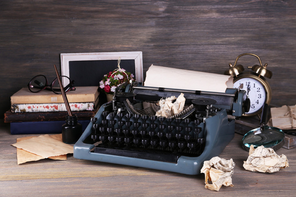 Retro typewriter on wooden background - Фото, зображення