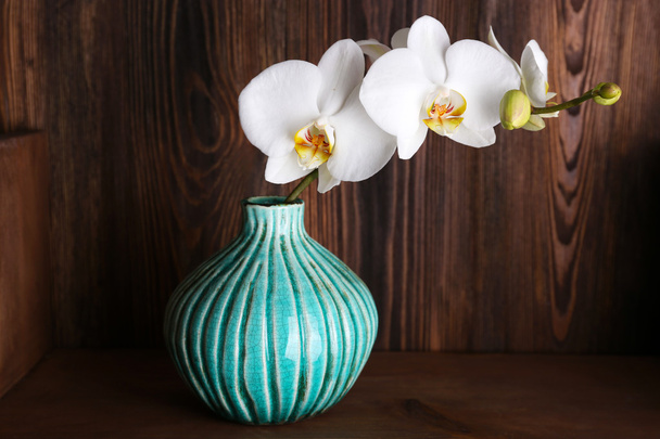 white orchid on wooden background - Fotó, kép