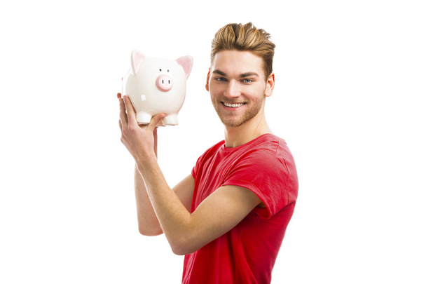 man holding a piggy bank - Fotoğraf, Görsel