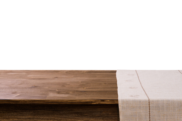 Empty wooden table with napkin and white background - Valokuva, kuva