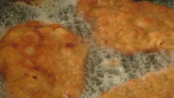 Fry chops in oil in a frying pan - Footage, Video