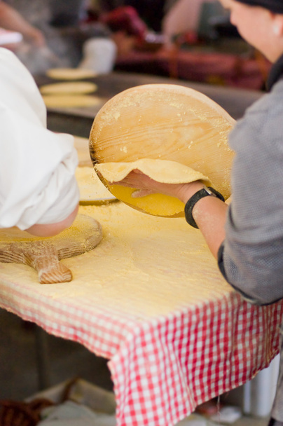 Woman Making talos, Tortilla than wraps txistorra. - Photo, Image