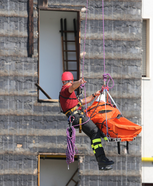 fireman during an exercise carries the stretcher - Photo, Image