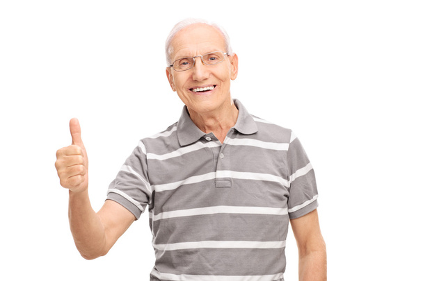 Senior man giving a thumb up - Photo, image