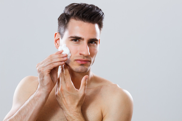 Handsome man shaving - Фото, изображение