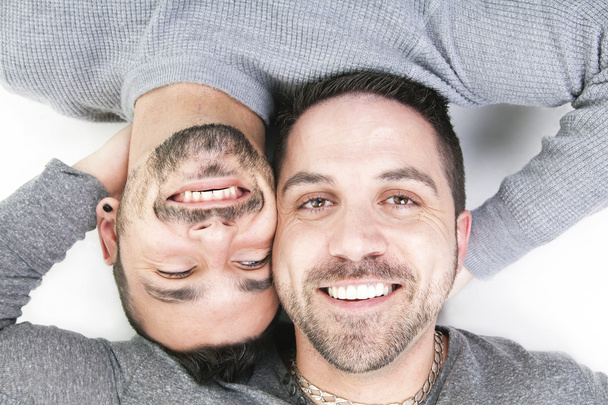 A homosexual couple over a white background - Foto, imagen