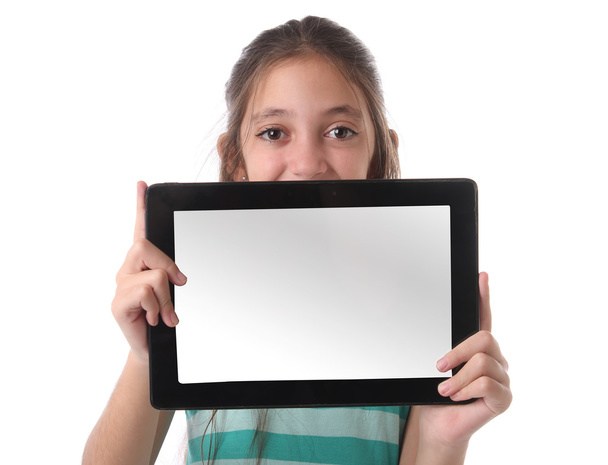 Beautiful pre-teen girl with a tablet computer. - Foto, Bild