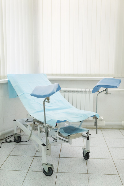 Gynecological chair in room - Foto, afbeelding