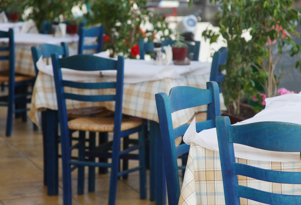 Blue chairs on a greek cafe - Φωτογραφία, εικόνα
