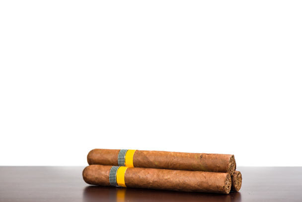 Cuban cigars isolated on wooden bar and white background - Photo, Image