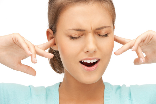Woman with fingers in ears - Photo, image