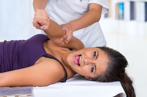 woman lying while getting a massage concept of physiotherapy - Fotoğraf, Görsel