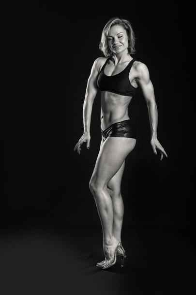 strong bodybuilder woman shows muscles - Photo, Image