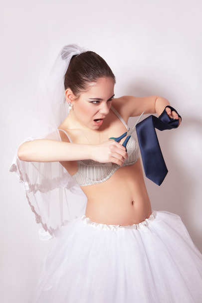 Wicked bride scissor a groom tie - Photo, Image