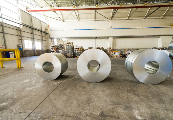 Cold rolled steel coils in storage area ready to feed to machine - Photo, Image