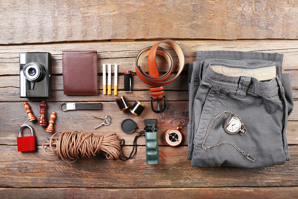 Hiking gear on wooden background - Foto, afbeelding