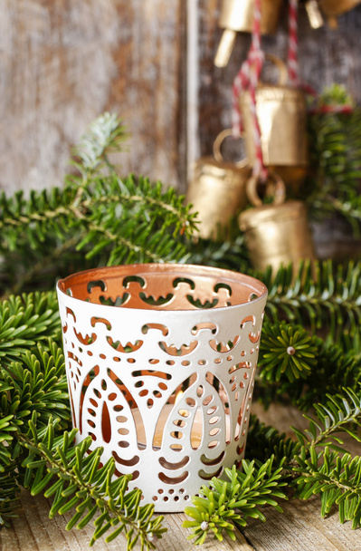 White candle holder with oriental ornaments among fir branches - Фото, изображение