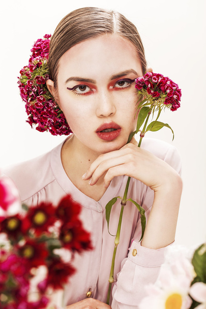 Gorgeous girl beauty portrait holding flower branch - Fotografie, Obrázek