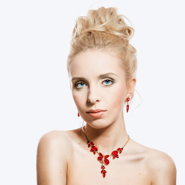 Portrait of beautiful blond woman with a ruby jewelry on. Natura - Photo, image