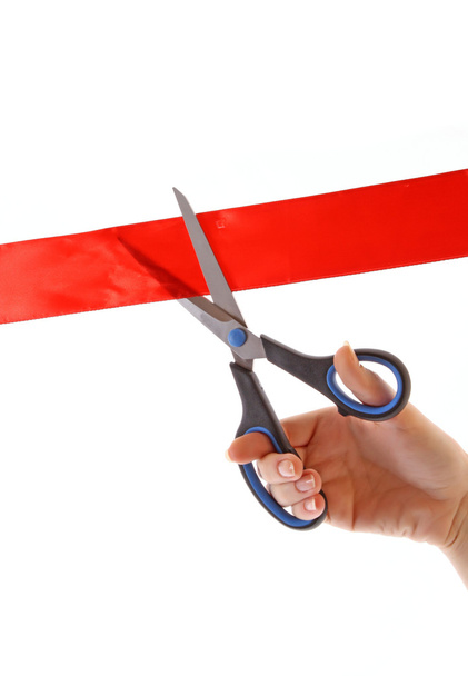Red ribbon with scissors isolated on white - Valokuva, kuva