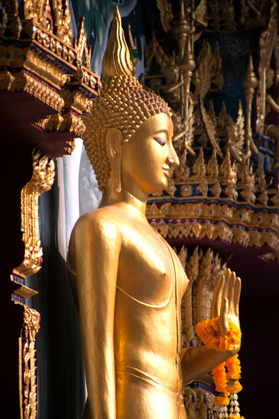 Standing Buddha front of Church on Thai temple in Thailand. - Photo, image