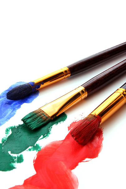 Paint brushes in color paint - Fotoğraf, Görsel