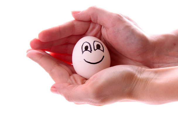 Egg with smile in the hand - Fotografie, Obrázek