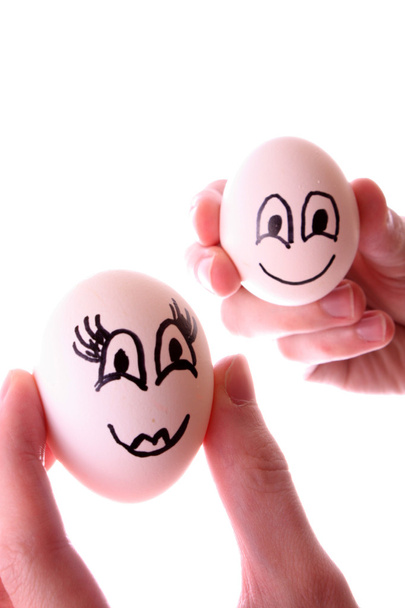 Two eggs in hands isolated on white - Valokuva, kuva