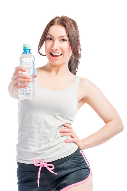 happy girl holds a bottle of drinking water - Foto, imagen
