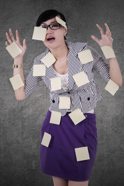 Stressful employee with paper notes - Photo, image