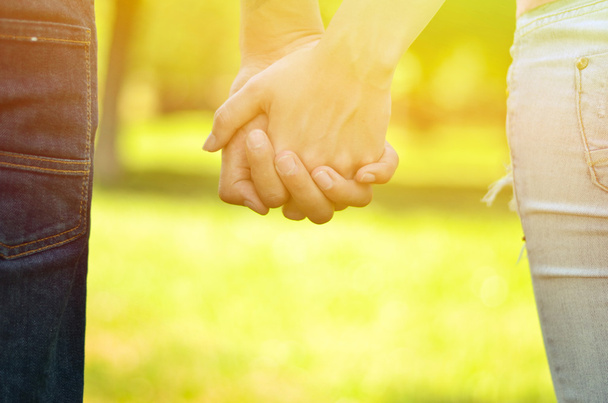 Couple holding hands - Фото, изображение