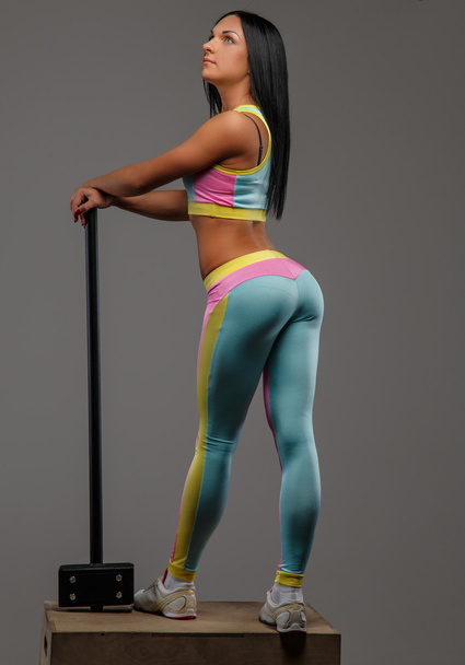 Female in colorful sportswear with hummer - Foto, Imagem