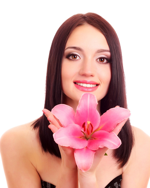 Beautiful young woman with lily flower - Fotó, kép