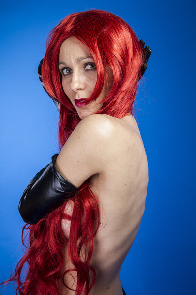 Attractive woman with huge red mane - 写真・画像